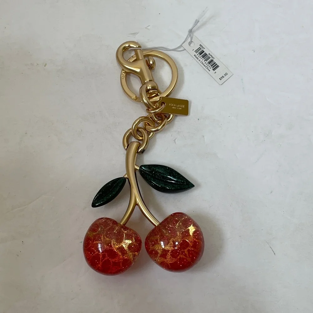 NEW WITH TAGS COACH SIGNATURE CHERRY BAG CHARM PINK